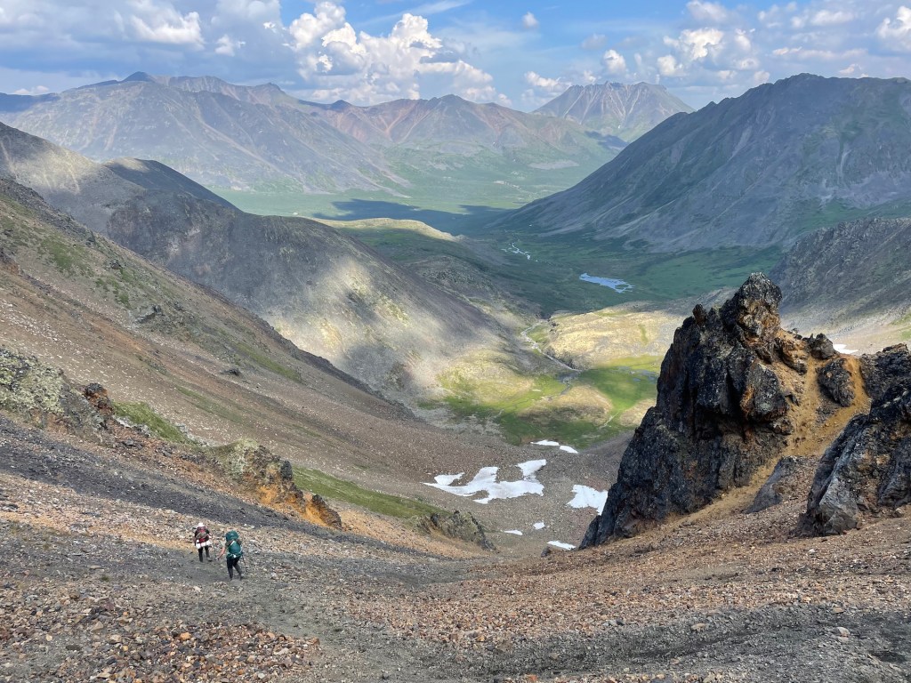 Hiking down Glissade Pass in Tombstone Territorial Park